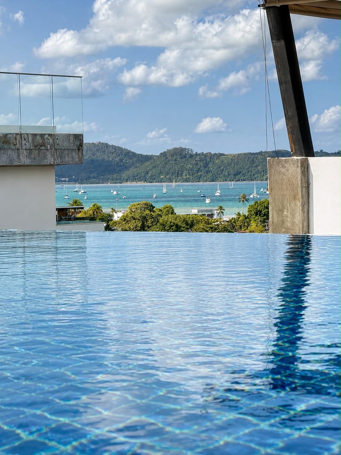 Rooftop infinity pool overlooking Chalong Bay