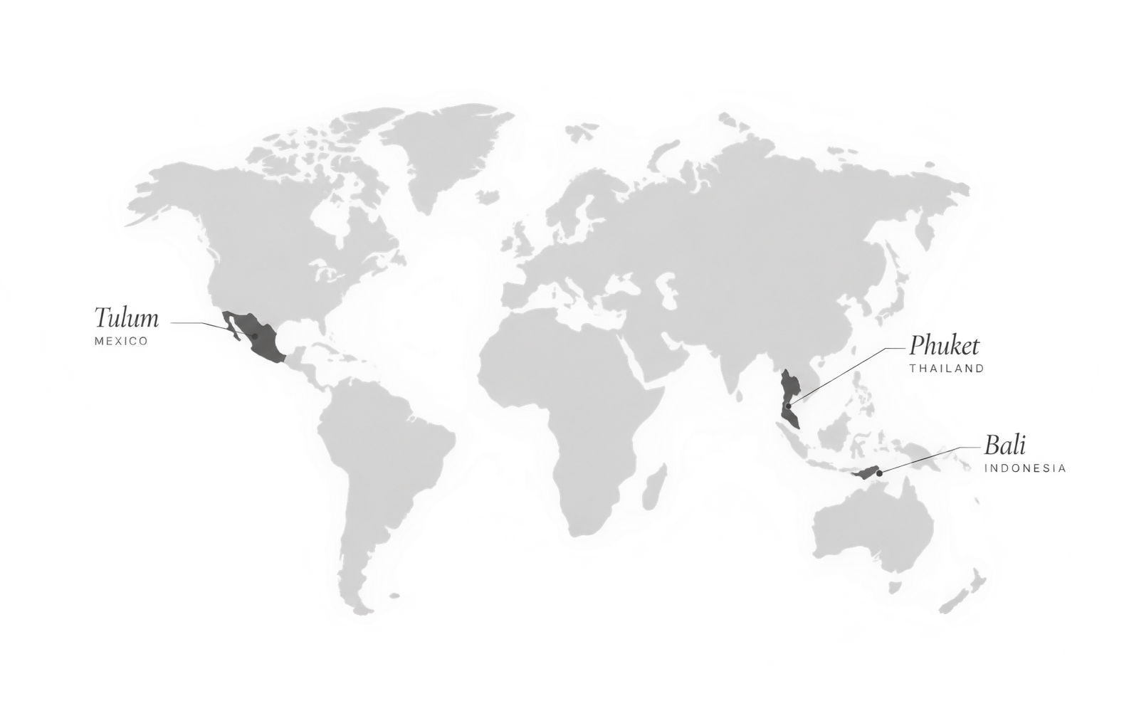 Grayscale world map with Tulum (Mexico), Phuket (Thailand) and Bali (Indonesia) marked